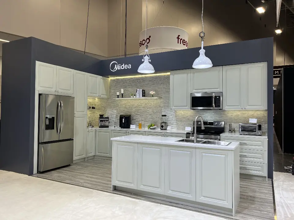 White shaker-style kitchen with an island and pendant lights
