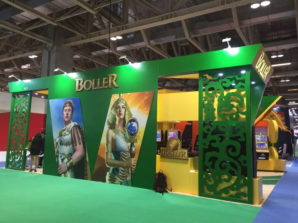 Exterior wall with goddess and warrior graphics and green ornamental screens