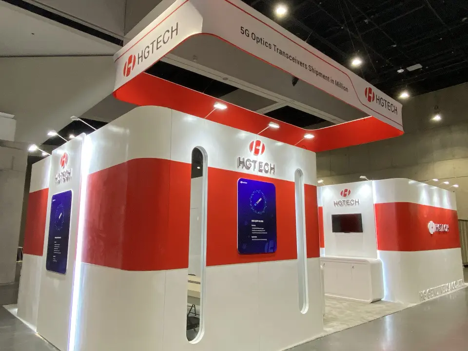 Rear of the booth with several screens set into the red bands