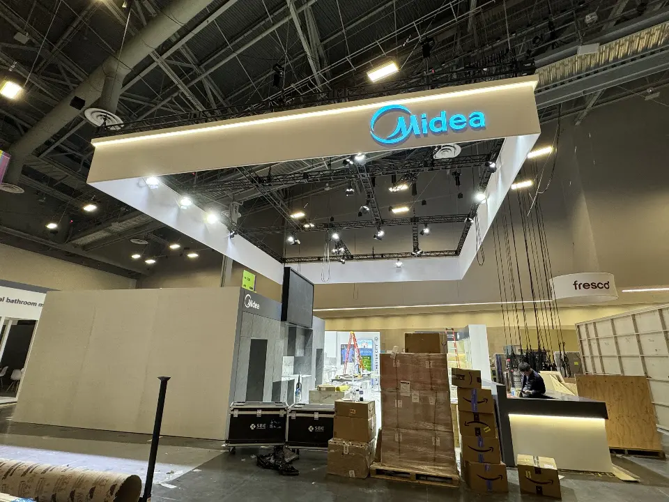 During installation: corner of the hanging frame with the Midea logo over a counter