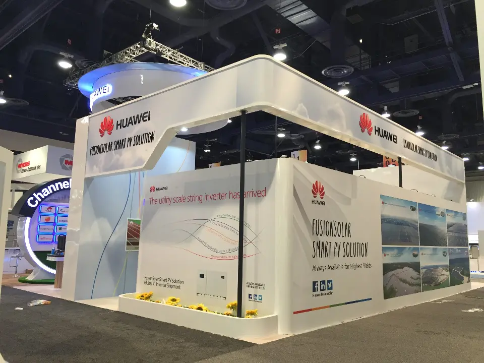 White exterior corner with FusionSolar Smart PV Solution wall graphics and Huawei branding