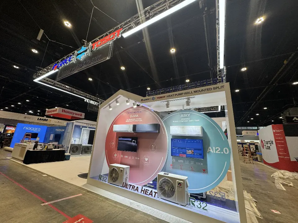 Circular pink and teal backlit graphics behind wall-mounted and split units