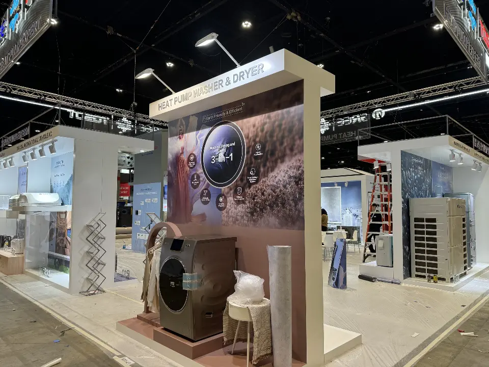 Washer dryer pillar seen from the aisle with spotlights and product walls behind