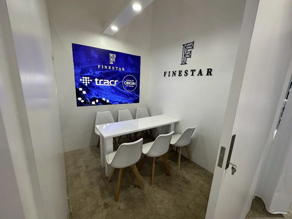 Small meeting room with backlit tracr panel and lit Finestar lettering