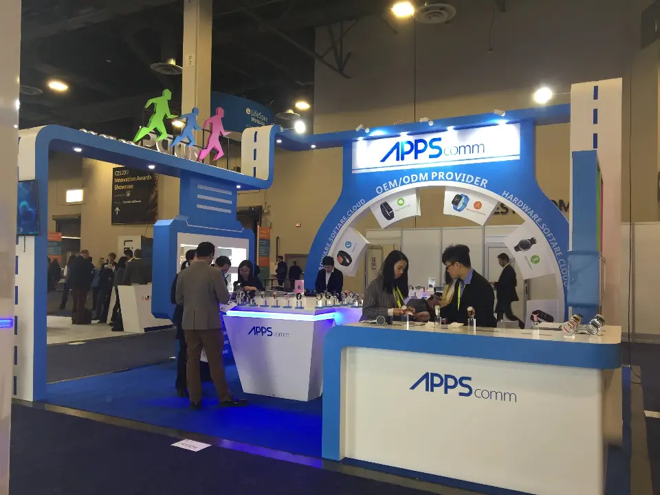 Angled view of the blue arch and white counter with staff and visitors