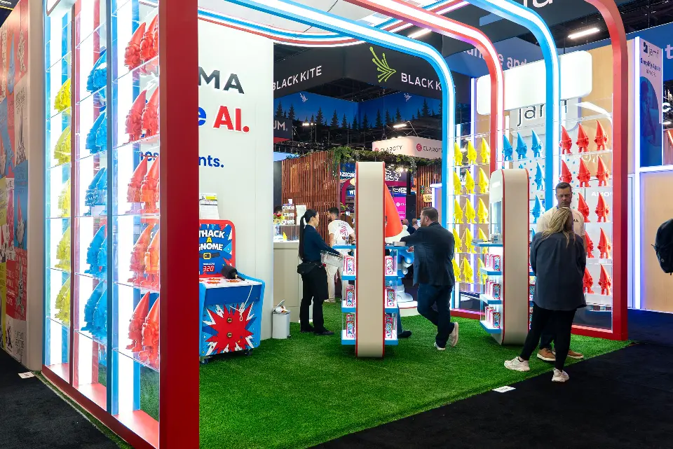 Inside view across turf floor with visitors between gnome shelving walls