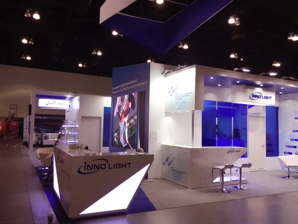 Blue glass wall and counter under the overhead InnoLight sign