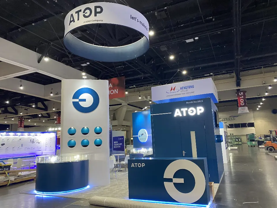 White column with the round blue logo and six domed product discs