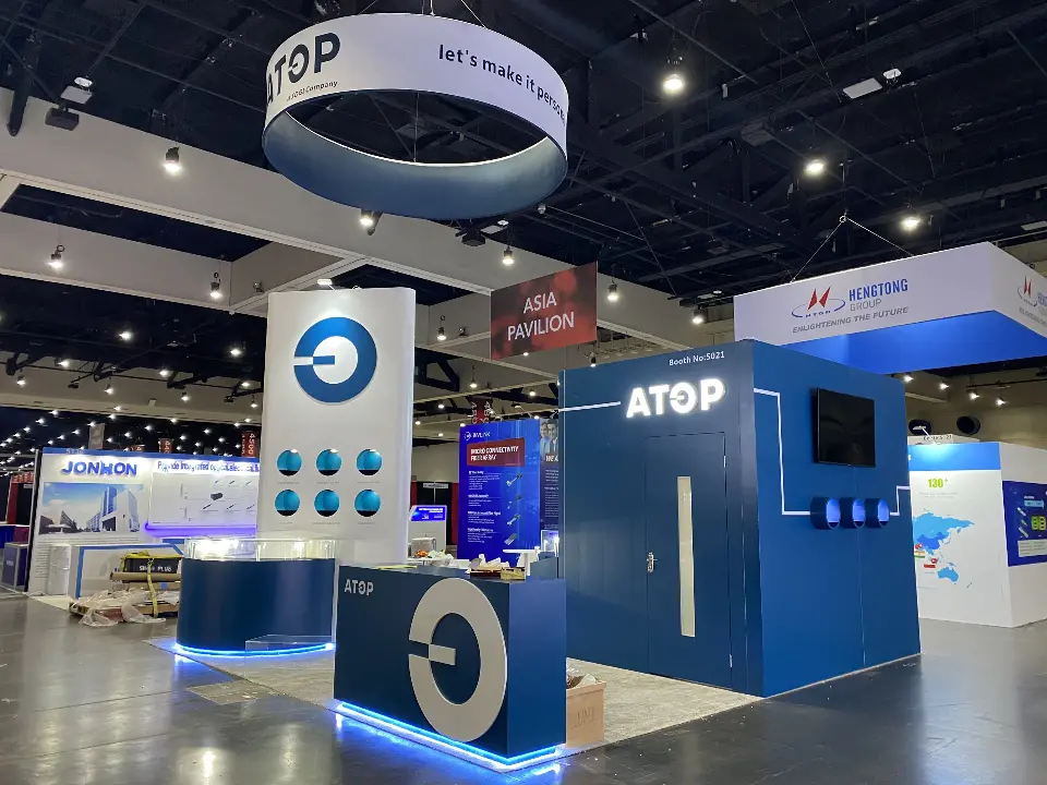 Front corner with the logo column, navy counter and hanging ring sign