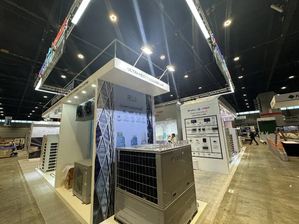 Corner product room with chiller units, spotlights and a rooftop sign