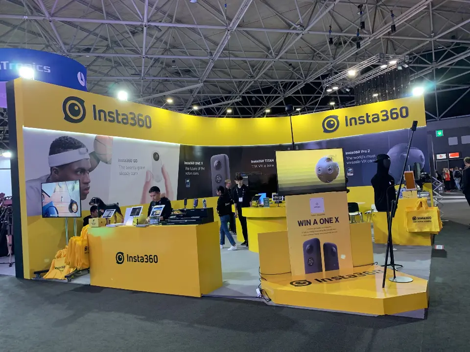 Angled view of yellow counters, camera graphics and the logo podium