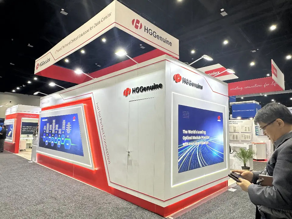 Front corner with red panels, blue graphic and a visitor in the aisle