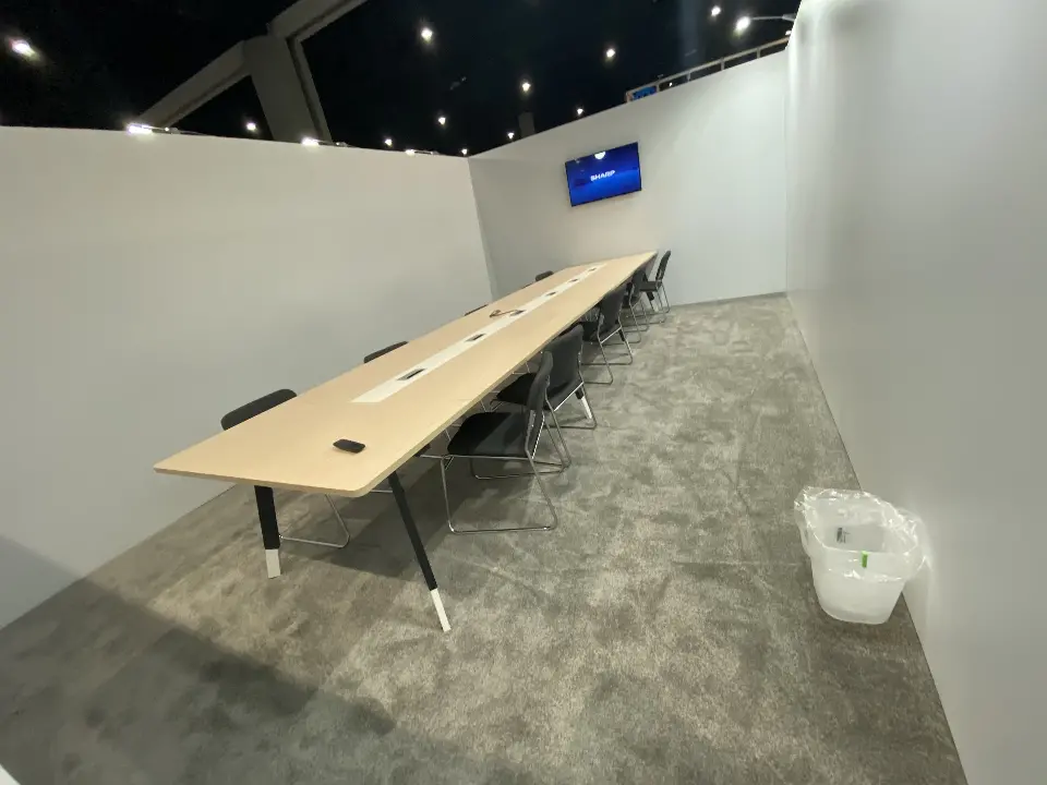 Meeting room table and screen from another angle