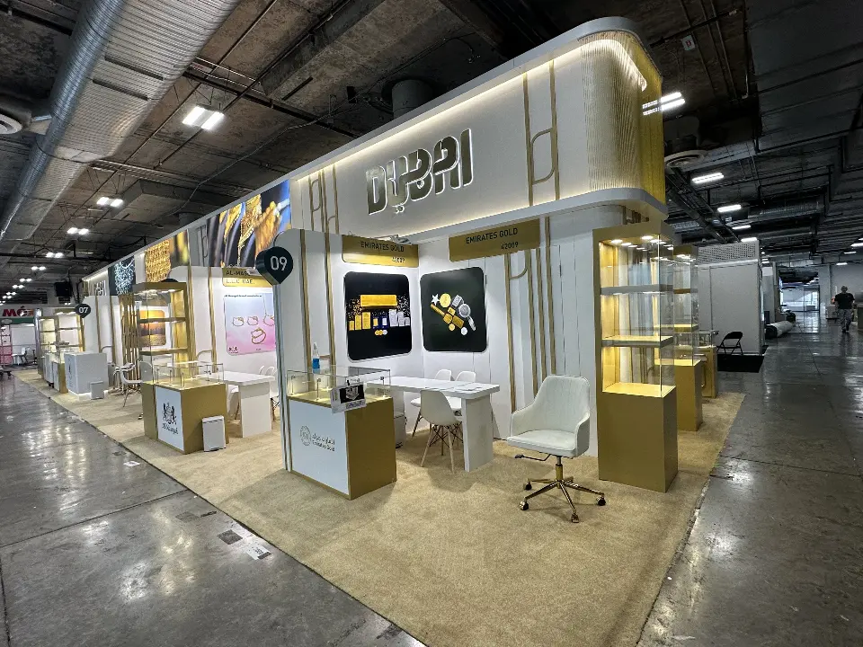 Wide view along the aisle showing the pavilion length and gold-trimmed walls