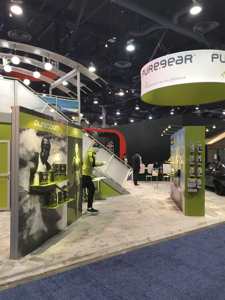 PureGear ring sign above green panels, phone case wall and pureboom graphics