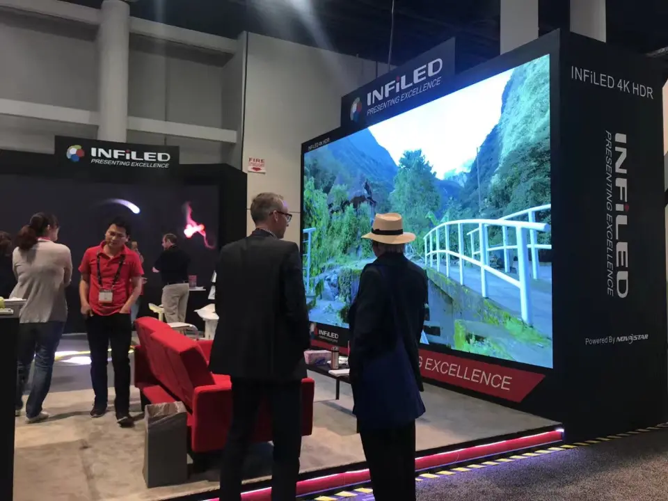 Mountain path landscape on the main screen with visitors standing nearby