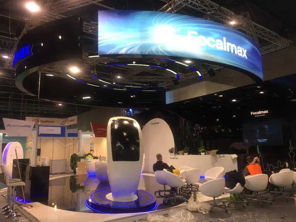 Front view of the Focalmax ring header with white egg kiosks and the black curved wall