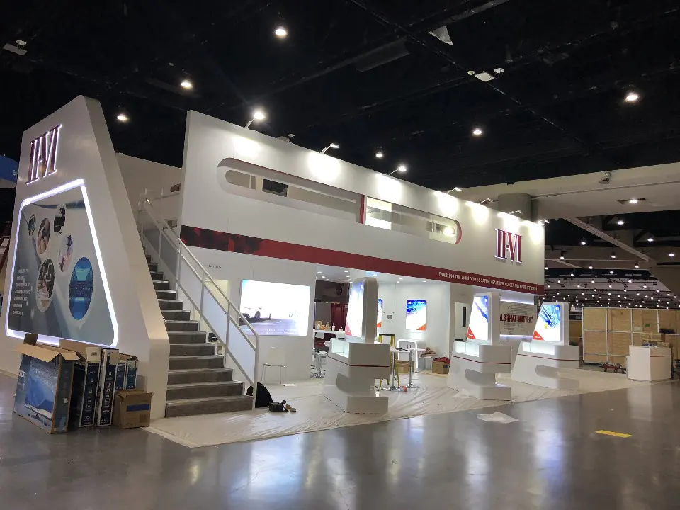 Staircase side with backlit kiosks and protective film on the floor