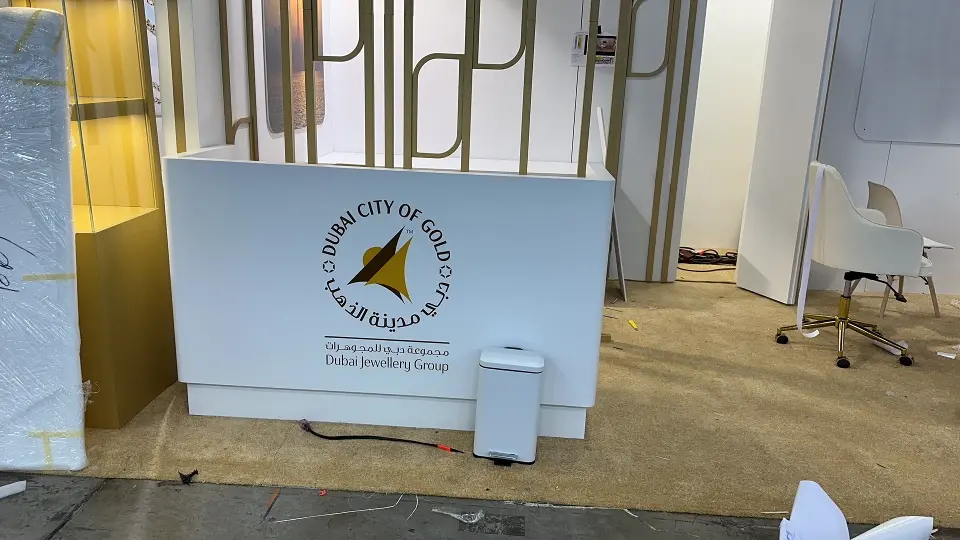 White counter front printed with the Dubai City of Gold round logo
