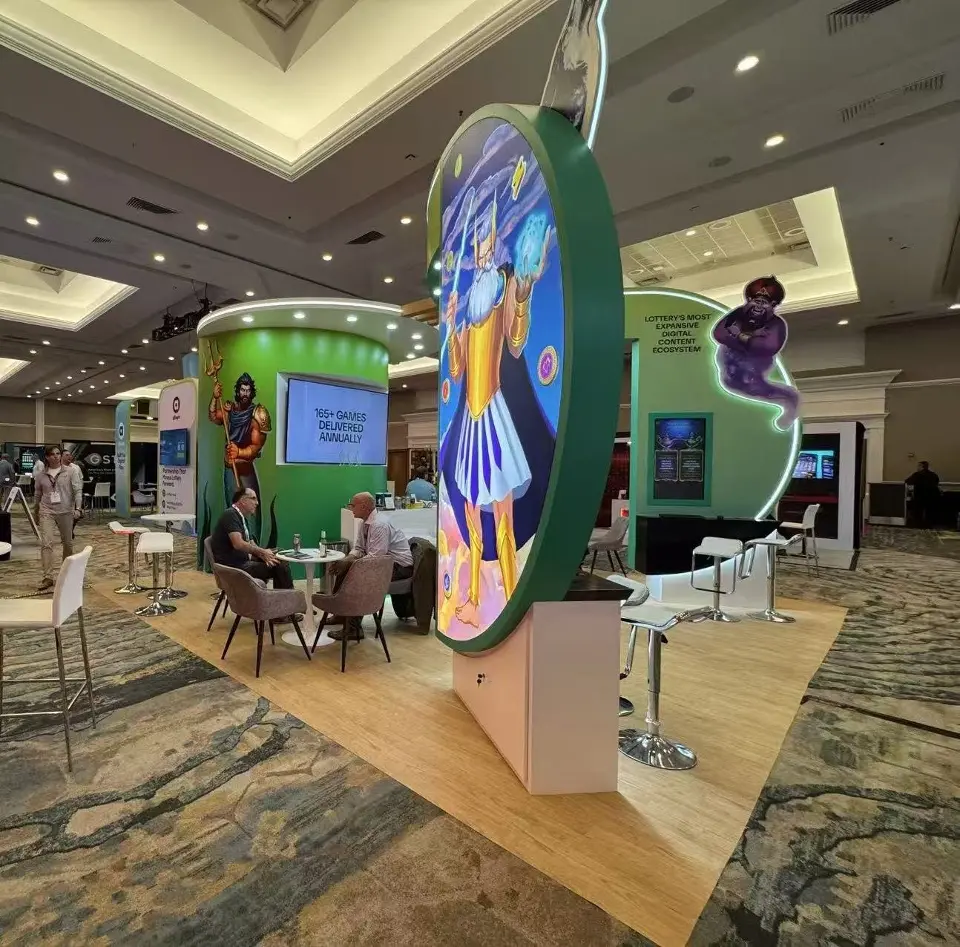 Round backlit thunder god panel in front of a green tower with a 165+ games delivered annually screen