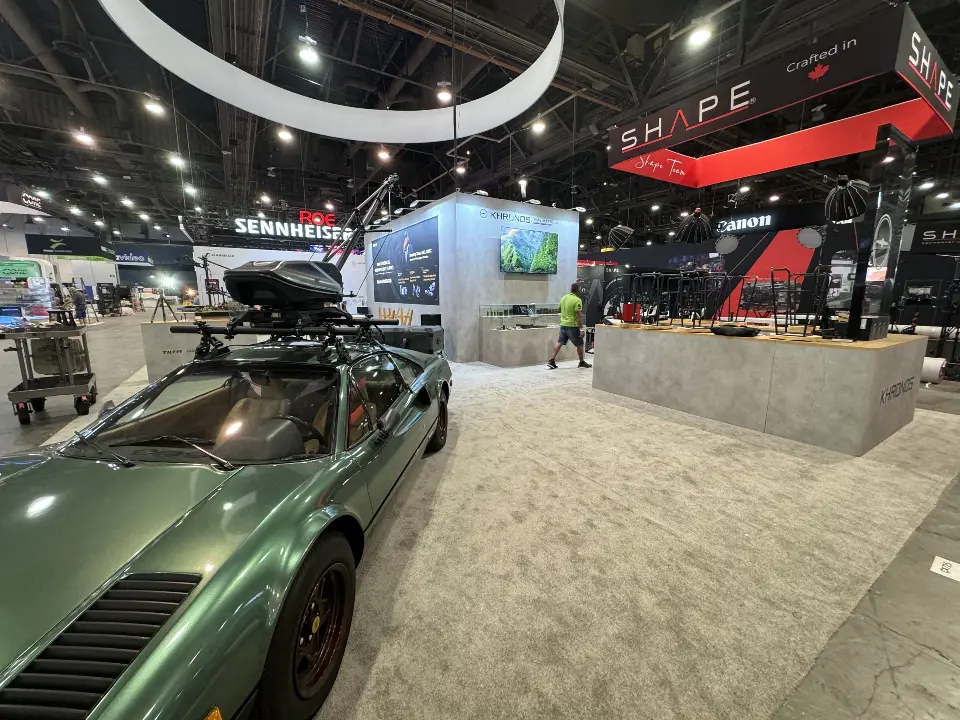 Close side angle of the green sports car with mounted camera arm