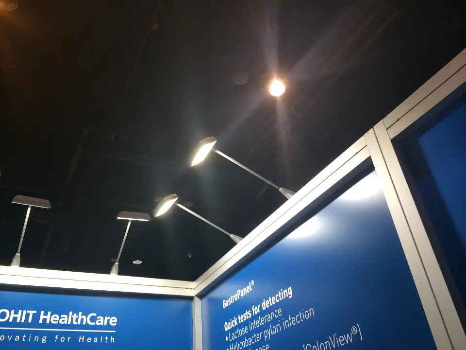 Upward view of ROHIT HealthCare blue wall graphics and arm lights on the frame