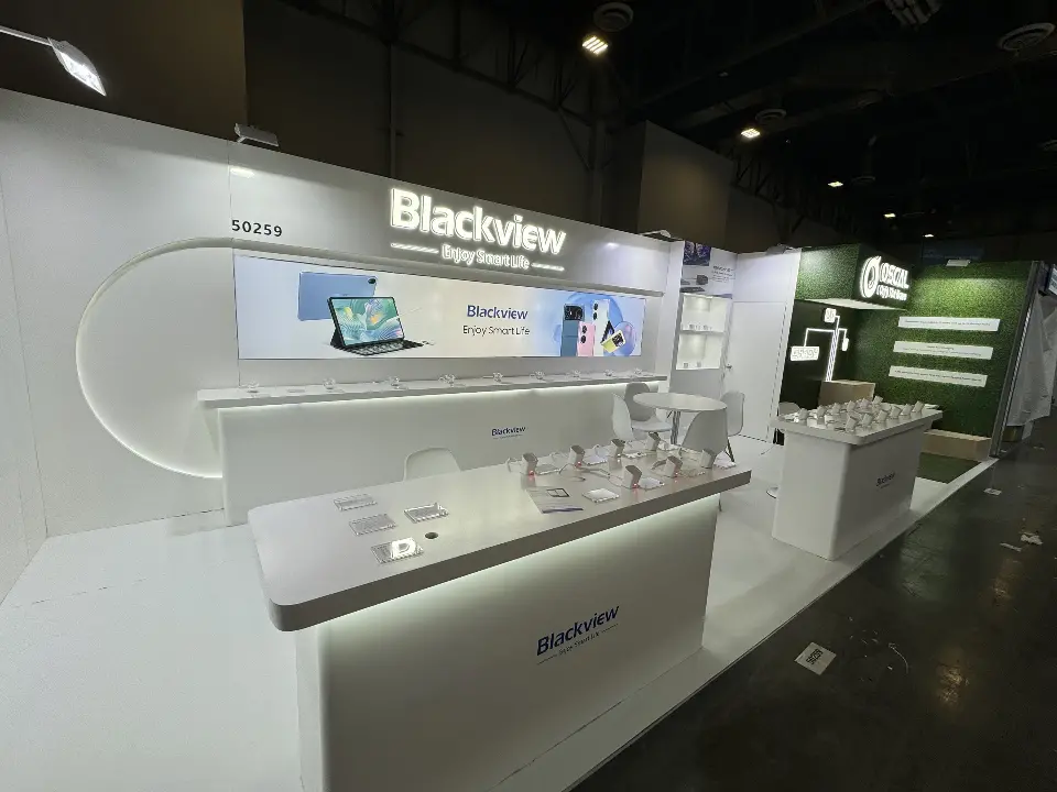 Front angle of the Blackview booth with devices on secured stands and lit counters