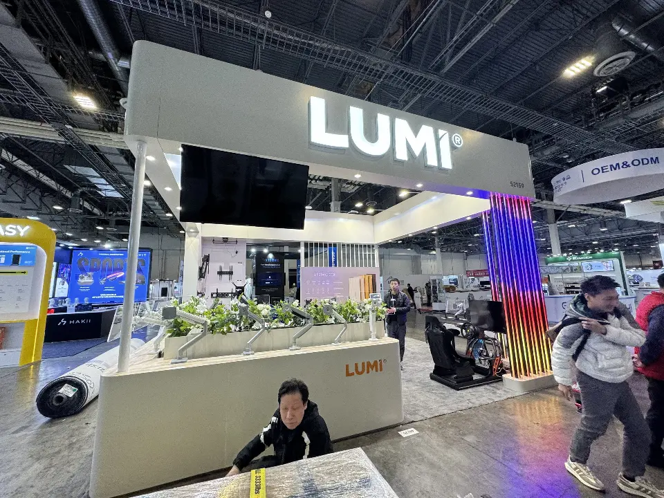 Front view of the planter-topped white counter under the LUMI header and wall screen