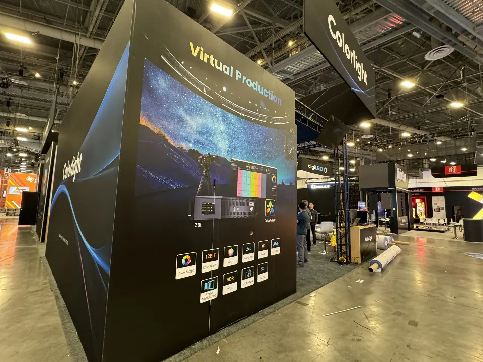 Virtual Production graphic wall with product icons beside the hanging Colorlight sign