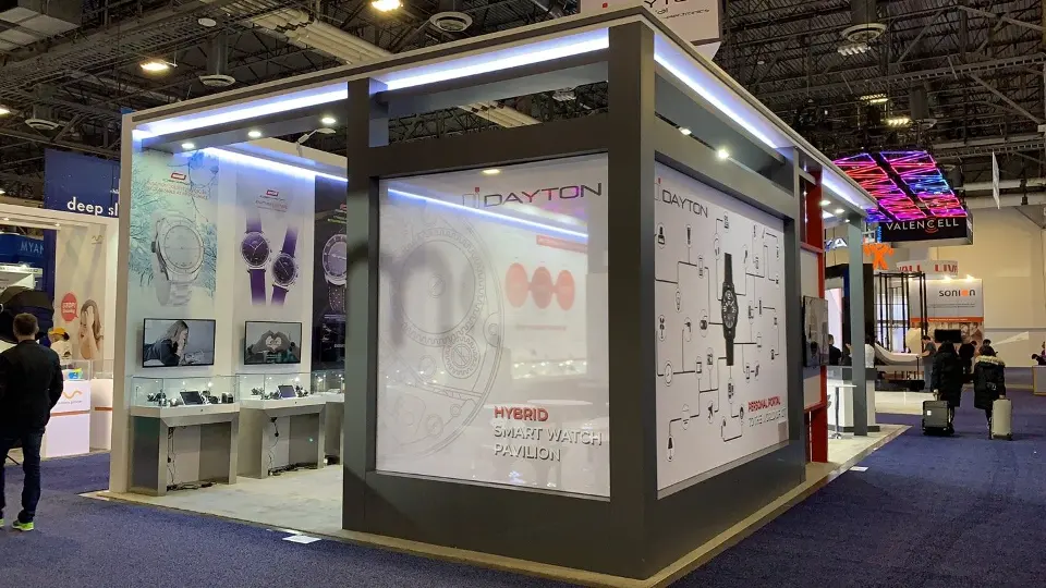 Side window view into the booth with showcases and white wall graphics