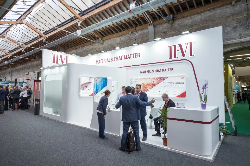 Angled view of guests at the counter with the burgundy line curving toward the logo