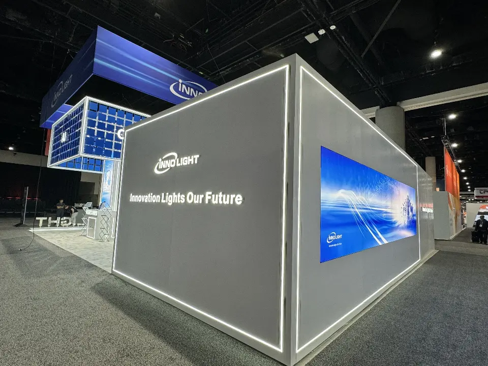 Corner of the grey lit-edge wall with a blue graphic panel on its side