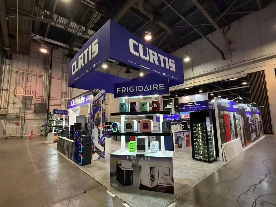 Angled view of Frigidaire-branded shelving under the navy Curtis hanging sign