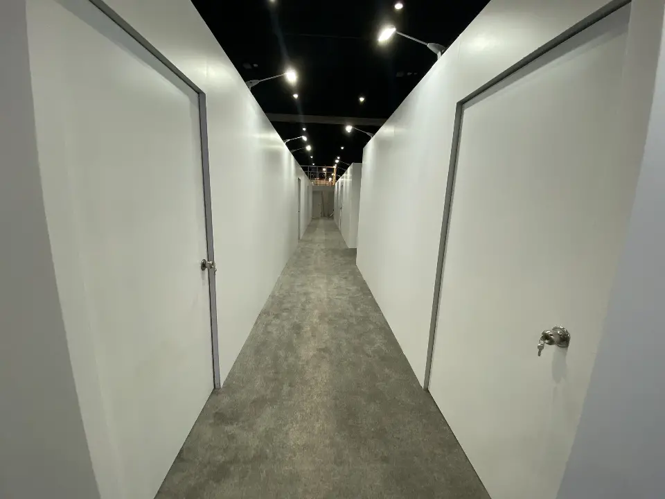 White corridor with doors leading to meeting rooms