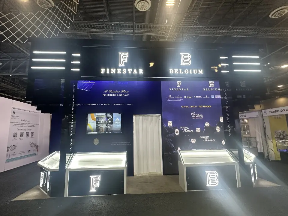 Showcase row in front of the navy wall with white light bars above
