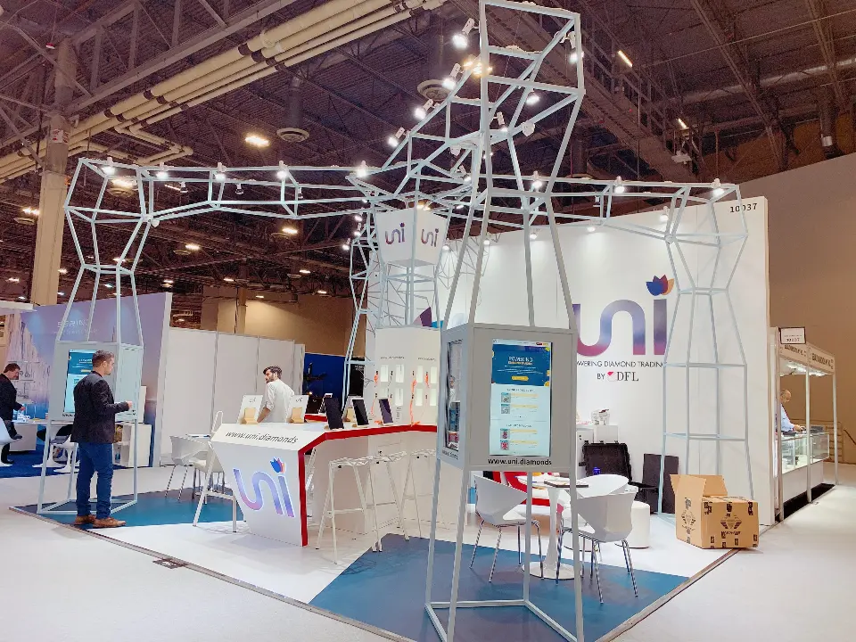 Side view of uni booth showing the full wire-frame canopy with string lights