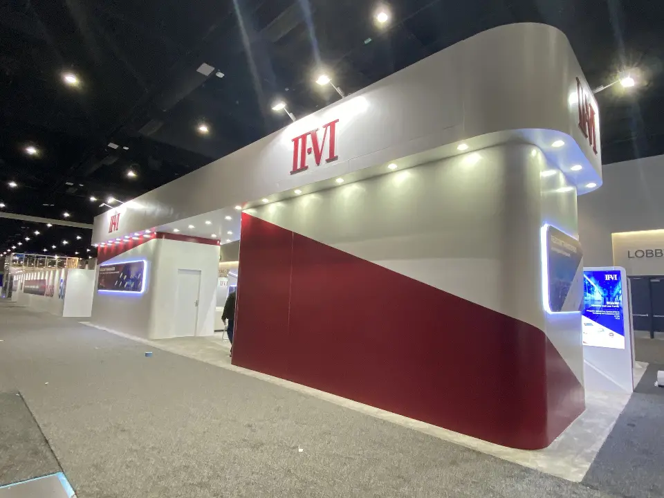 Red diagonal wall and white curved fascia with II-VI logo