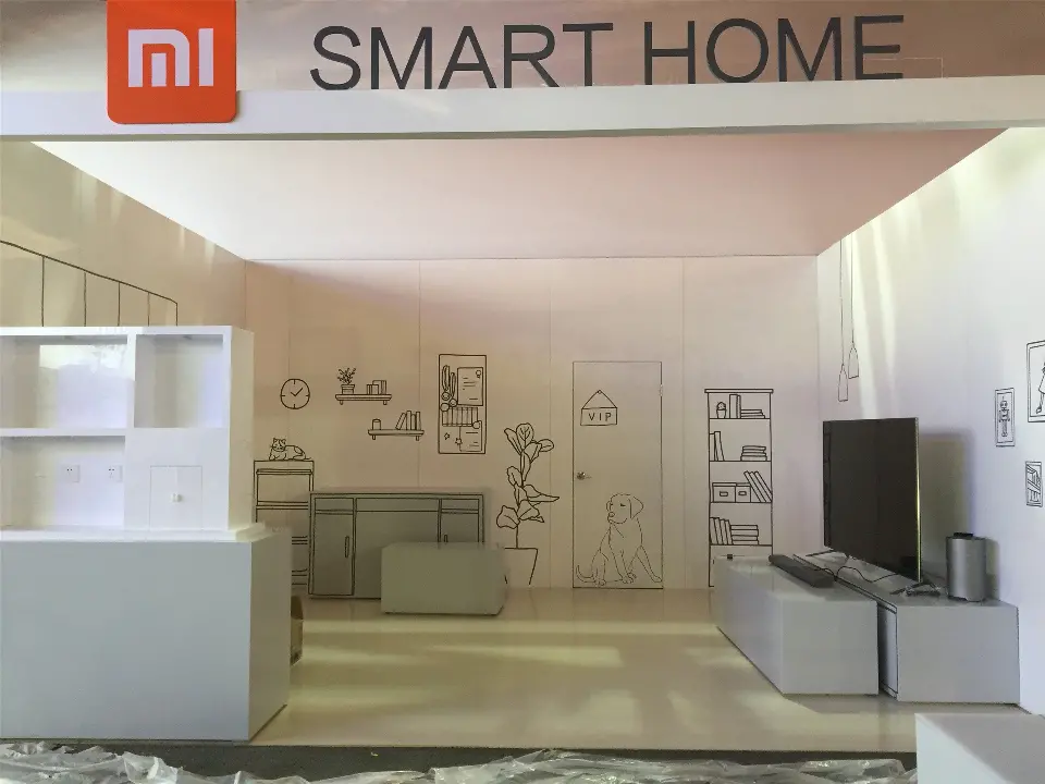 During build-up: SMART HOME fascia with the Mi logo over a line-drawing living room