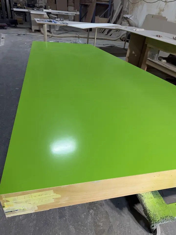 During build-up: lime-green panel edge resting on its frame
