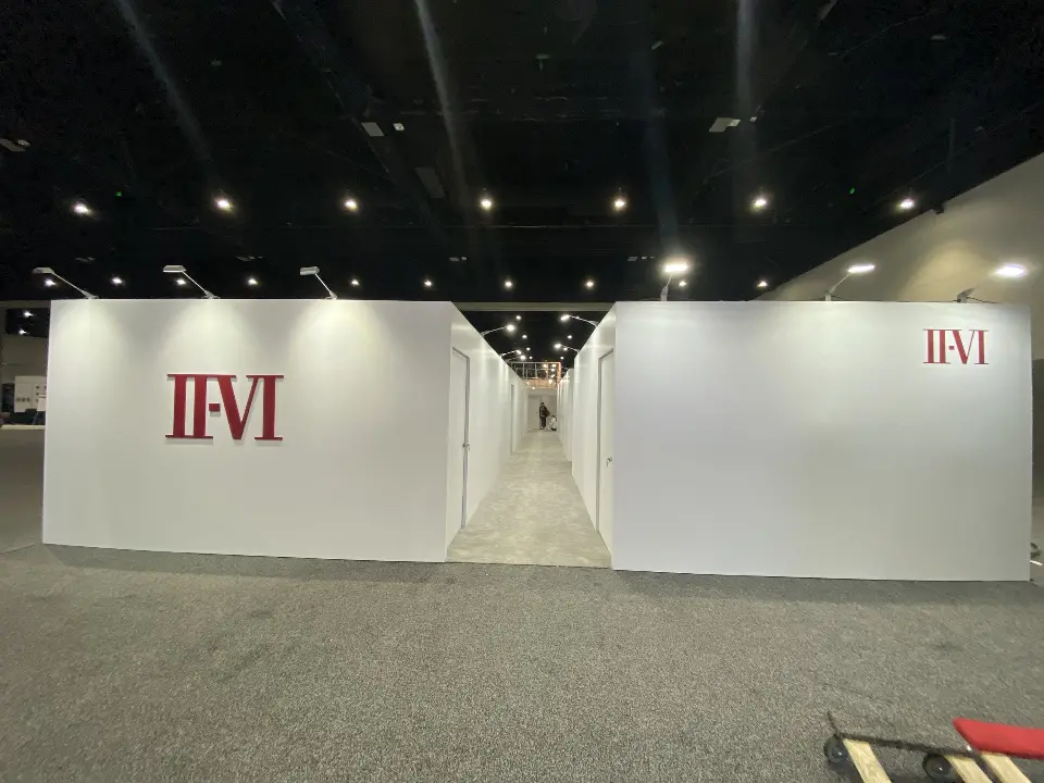 White meeting room walls with II-VI logos at each end