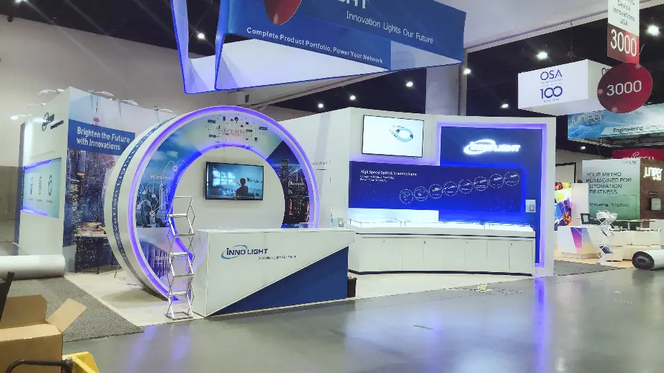 Wide view of the glowing ring arch with screen, counter and hanging banner