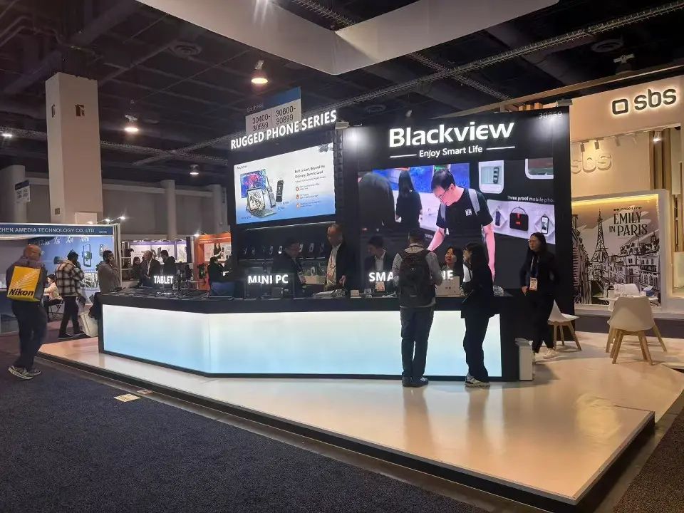 Long backlit counter under the Blackview wall graphic with staff and visitors