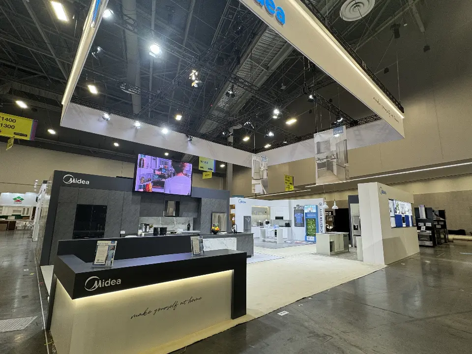 Front counter and screens with display walls across the booth