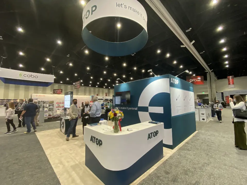 Front of the curved counter with ATOP logo and flowers on top