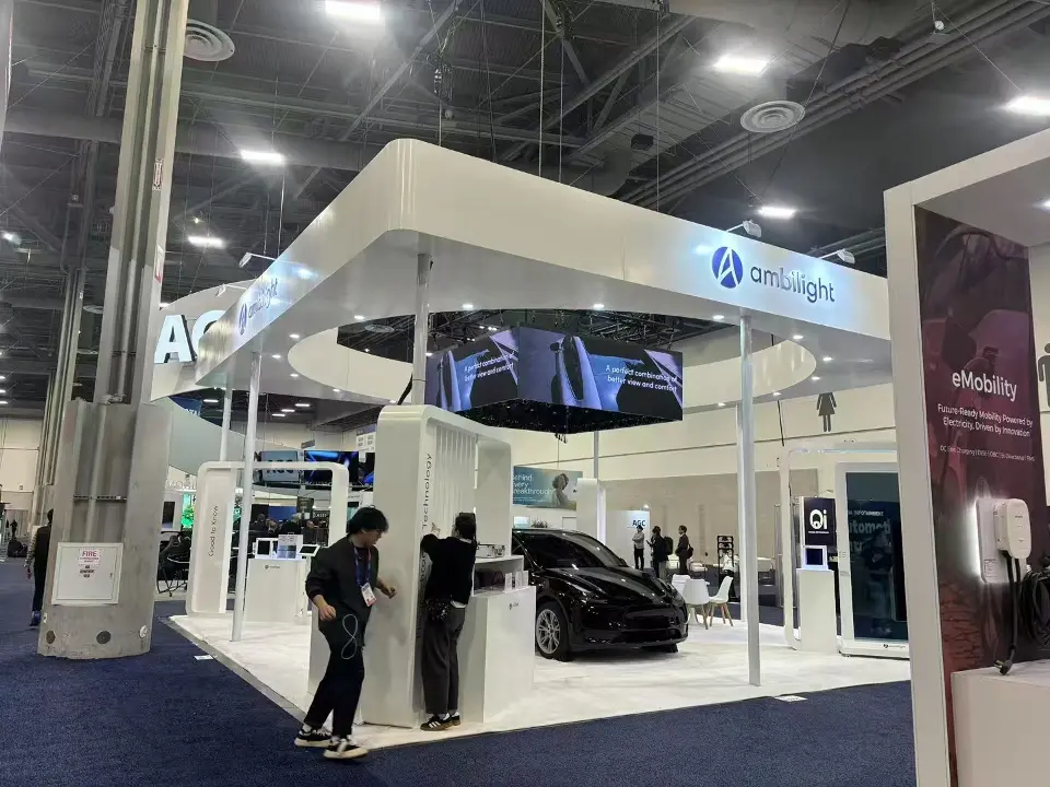 Closer angle into the Ambilight space with the black car, hanging cube screen and eMobility panel