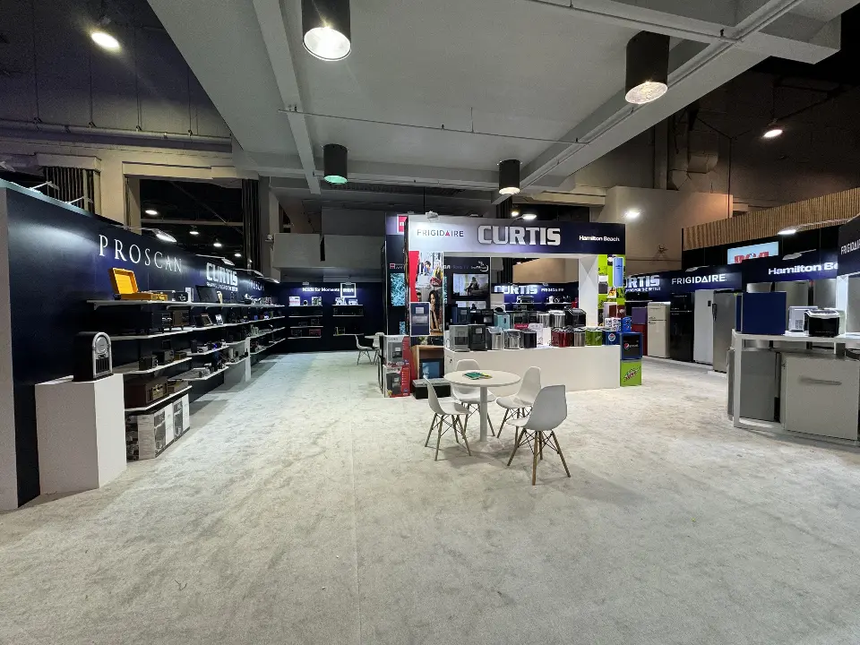Open white floor with a cafe table and product walls around it