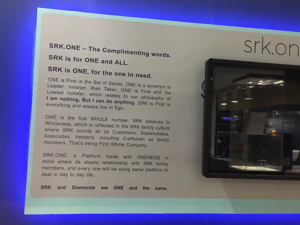 Close-up of a backlit SRK ONE text panel with blue edge glow