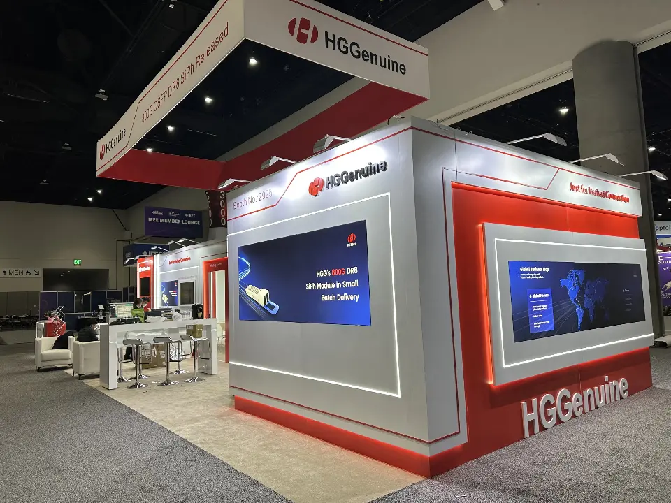 Side view of red angled frame around a backlit graphic and a small meeting area