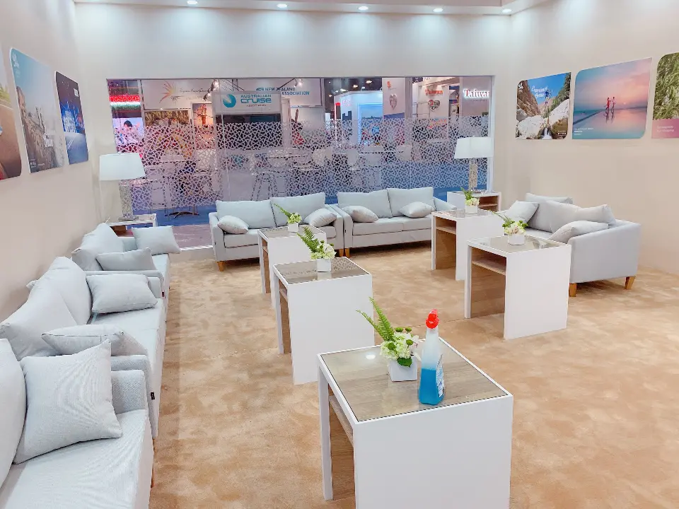 Lounge with cushioned sofas and a view through the glass wall