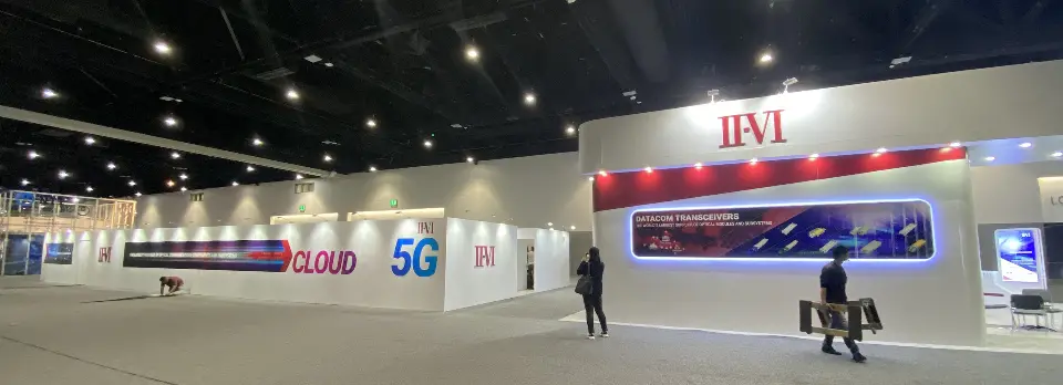 Panoramic view of the booth with red fascia and backlit band